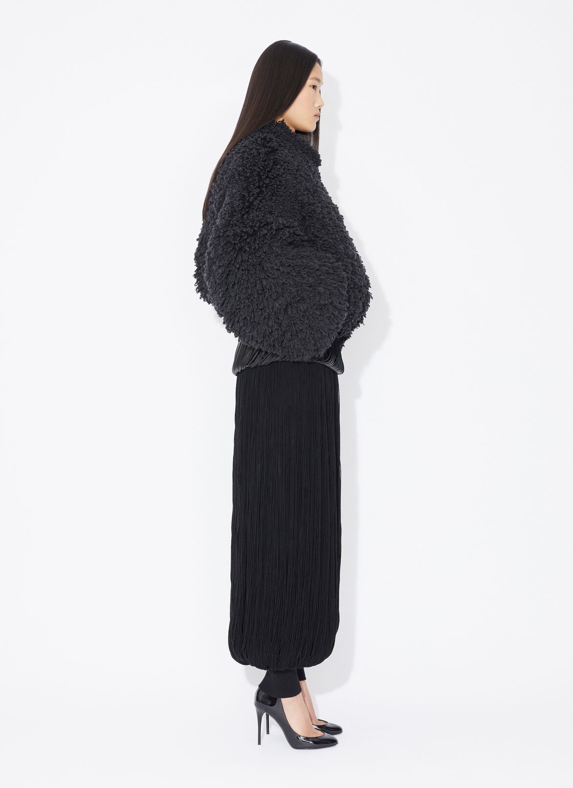 KNITTED FRINGE ROUND PANTS ALAÏA BLACK KNITTED FRINGE ROUND PANTS